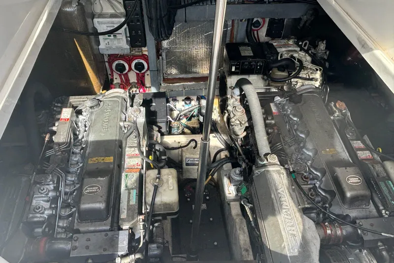 Distraction Yacht Photos Pics Engine room of a 2004 Luhrs 32 Open boat, featuring dual Yanmar engines.