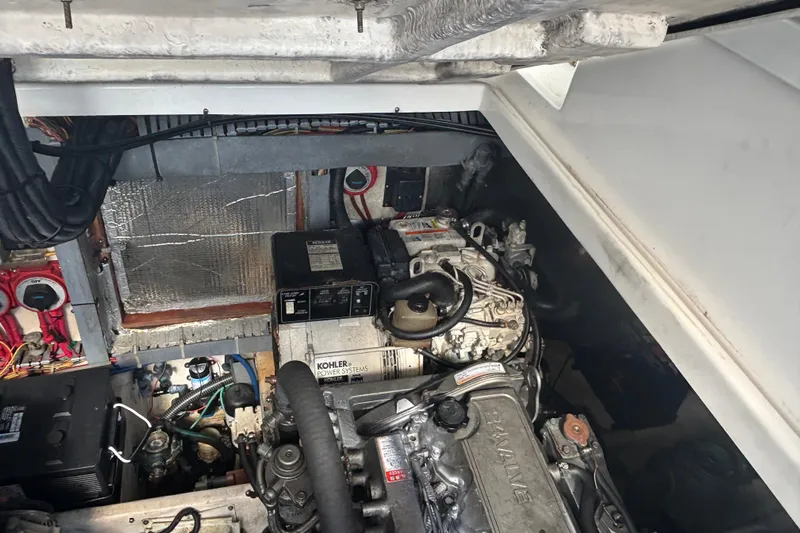 Distraction Yacht Photos Pics Engine compartment of a 2004 Luhrs 32 Open boat, featuring Kohler power systems.