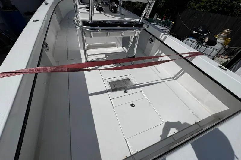  Yacht Photos Pics 2022 Whitewater 28 Open boat interior with spacious deck and modern design.