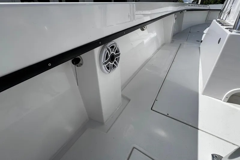  Yacht Photos Pics 2022 Whitewater 28 Open boat interior with speaker and clean deck design.