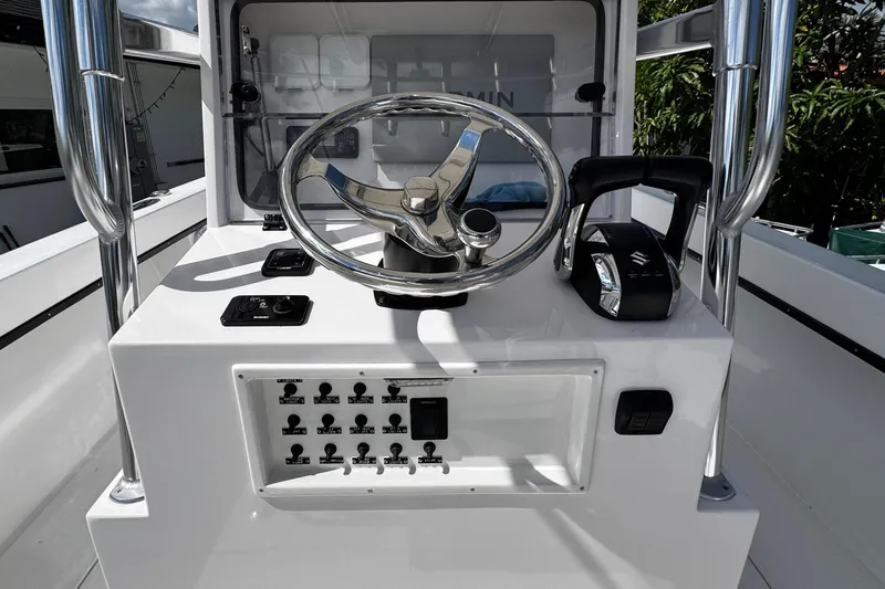  Yacht Photos Pics 2022 Whitewater 28 Open boat console with steering wheel and controls.