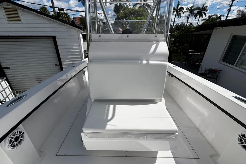  Yacht Photos Pics 2022 Whitewater 28 Open boat interior with white seating and clear skies.