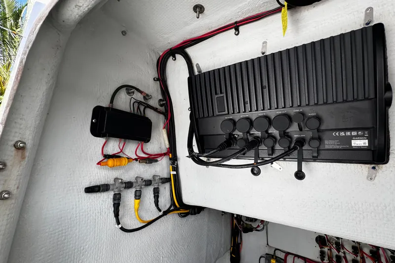  Yacht Photos Pics Electrical panel inside 2022 Whitewater 28 Open boat, featuring wiring and connections.