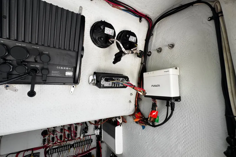  Yacht Photos Pics Electrical panel inside a 2022 Whitewater 28 Open boat, featuring various electronic components.