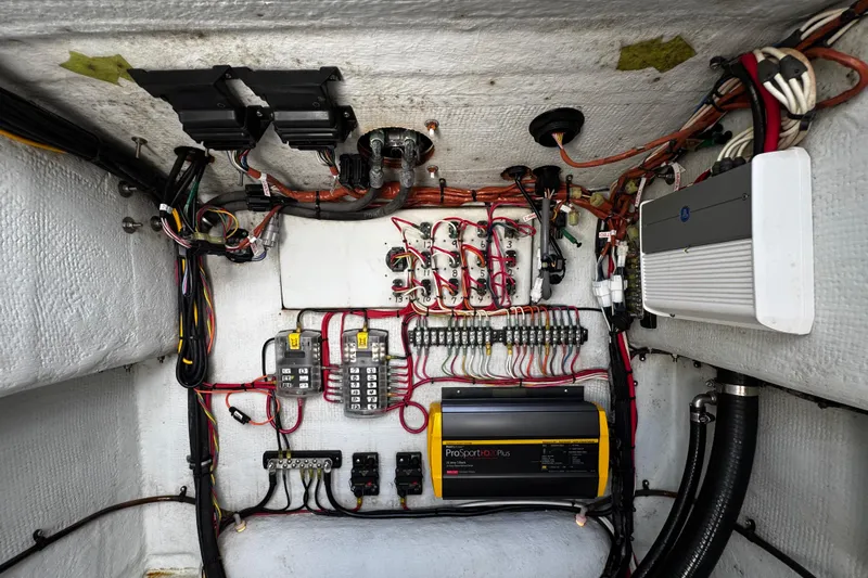  Yacht Photos Pics Electrical system inside a 2022 Whitewater 28 Open boat, featuring wiring and components.
