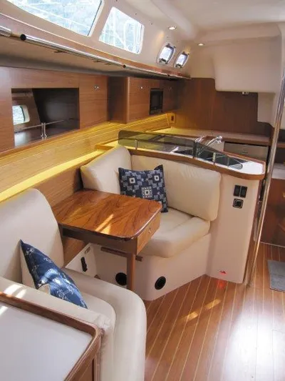 Hurkle Durkle Yacht Photos Pics 2024 Catalina 385 yacht interior with wooden finish and cozy seating area.
