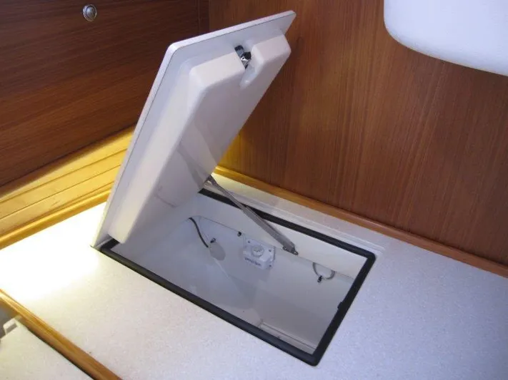 Hurkle Durkle Yacht Photos Pics Open hatch on 2024 Catalina 385 yacht, showcasing interior storage compartment.