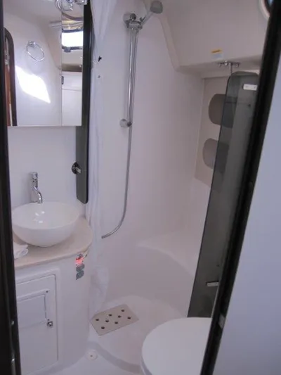 Hurkle Durkle Yacht Photos Pics 2024 Catalina 385 yacht bathroom with modern fixtures and compact design.