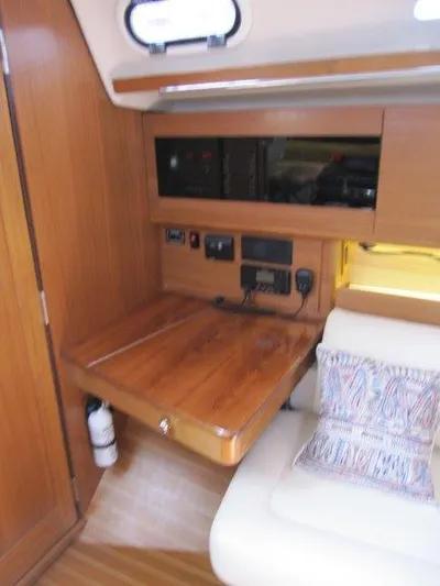 Hurkle Durkle Yacht Photos Pics 2024 Catalina 385 yacht interior with wooden desk and seating area.