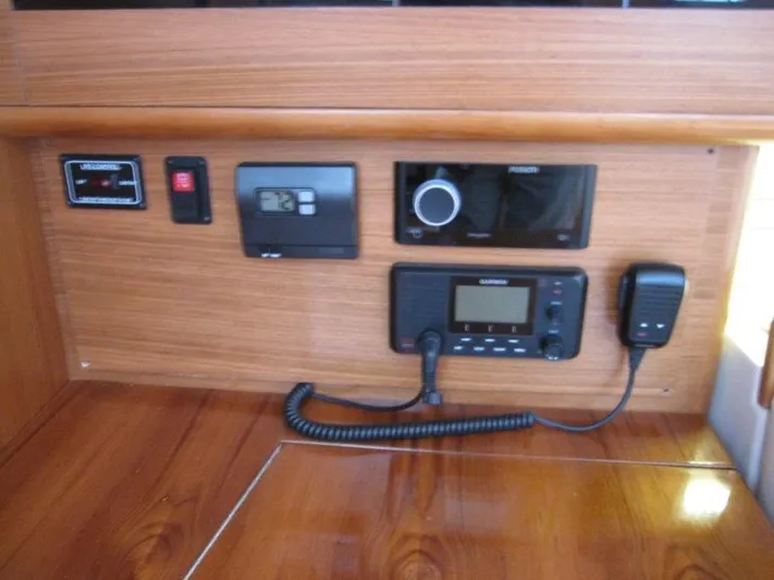 Hurkle Durkle Yacht Photos Pics Control panel of 2024 Catalina 385 sailboat with radio and navigation equipment.