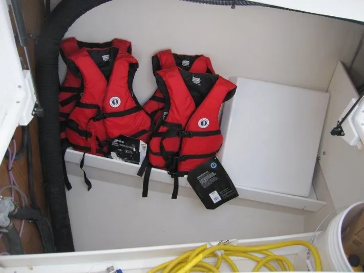 Hurkle Durkle Yacht Photos Pics Red life jackets stored in a Catalina 385 sailboat, model year 2024.