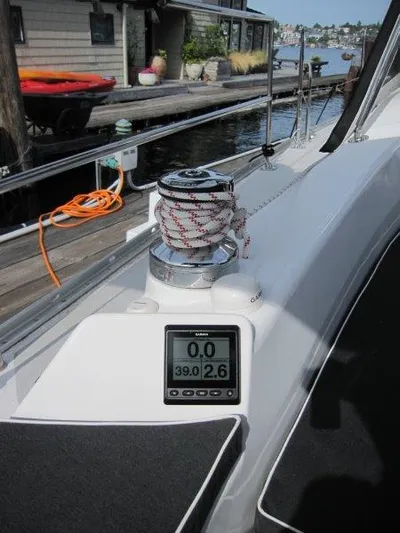 Hurkle Durkle Yacht Photos Pics 2024 Catalina 385 sailboat deck with winch and digital display, docked by waterfront.