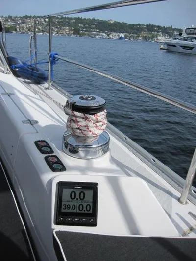 Hurkle Durkle Yacht Photos Pics 2024 Catalina 385 sailboat deck with winch and digital display on a calm lake.