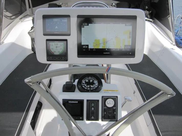 Hurkle Durkle Yacht Photos Pics Cockpit of 2024 Catalina 385 sailboat with navigation instruments and steering wheel.