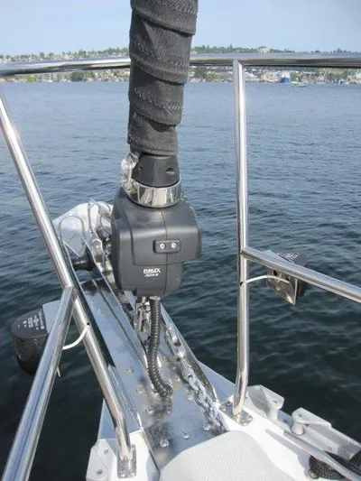 Hurkle Durkle Yacht Photos Pics 2024 Catalina 385 sailboat bow with anchor windlass on calm water.