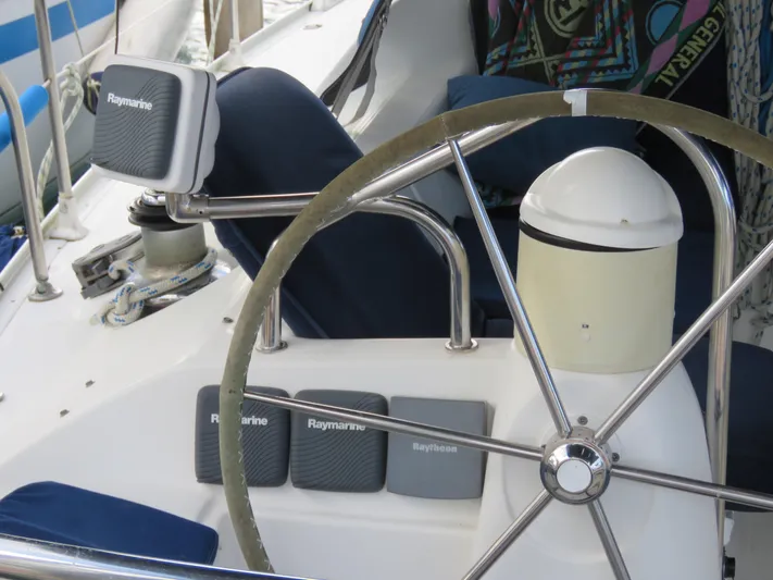  Yacht Photos Pics Steering wheel and Raymarine equipment on 2000 Jeanneau Sun Odyssey 40 sailboat.
