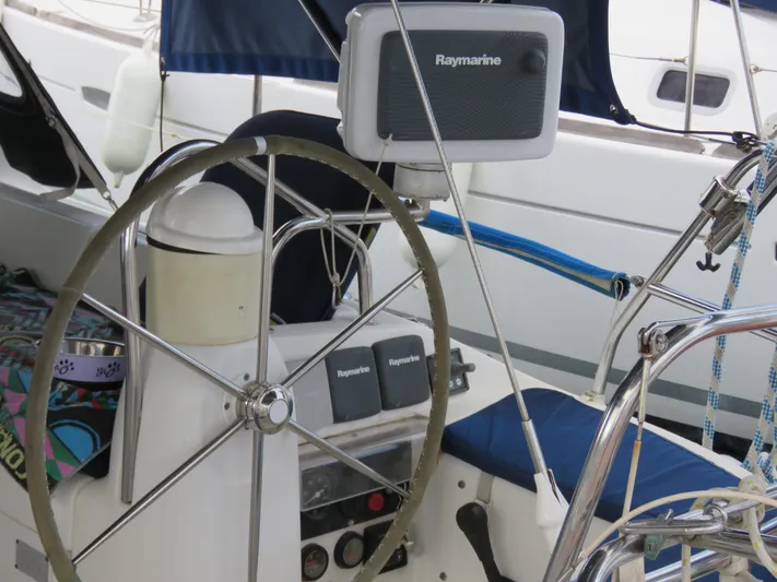  Yacht Photos Pics Steering wheel and navigation equipment on 2000 Jeanneau Sun Odyssey 40 sailboat.