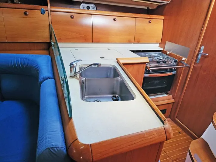  Yacht Photos Pics Interior of 2000 Jeanneau Sun Odyssey 40 yacht with kitchen sink and stove.