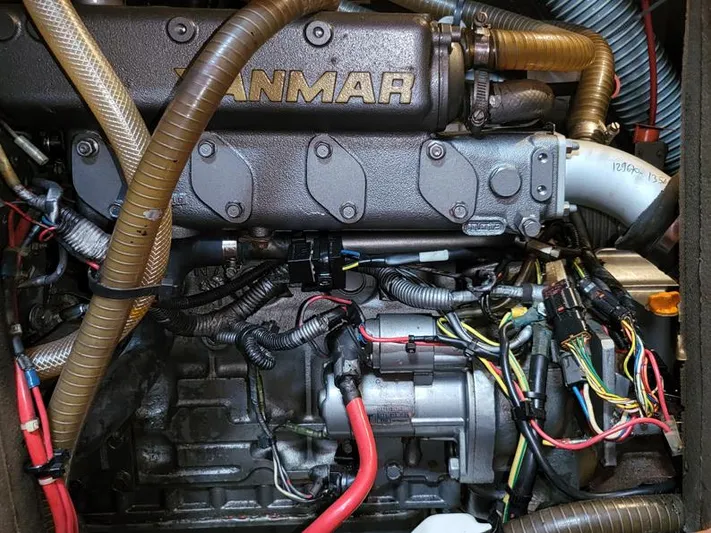  Yacht Photos Pics Engine of a 2000 Jeanneau Sun Odyssey 40 sailboat, featuring Yanmar components and wiring.