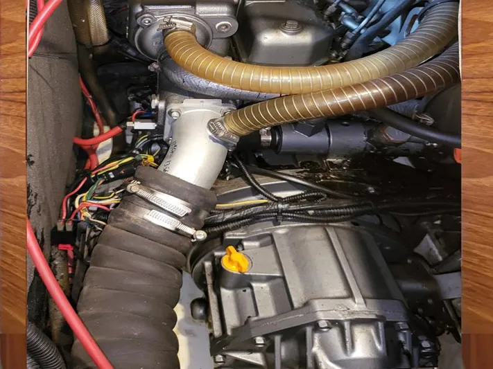  Yacht Photos Pics Engine compartment of a 2000 Jeanneau Sun Odyssey 40 sailboat, showing hoses and wiring.