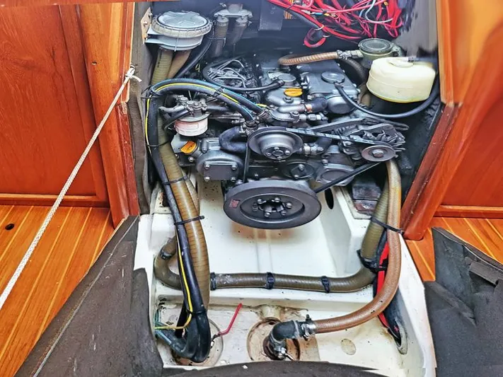  Yacht Photos Pics Engine compartment of a 2000 Jeanneau Sun Odyssey 40 sailboat, showcasing mechanical components.