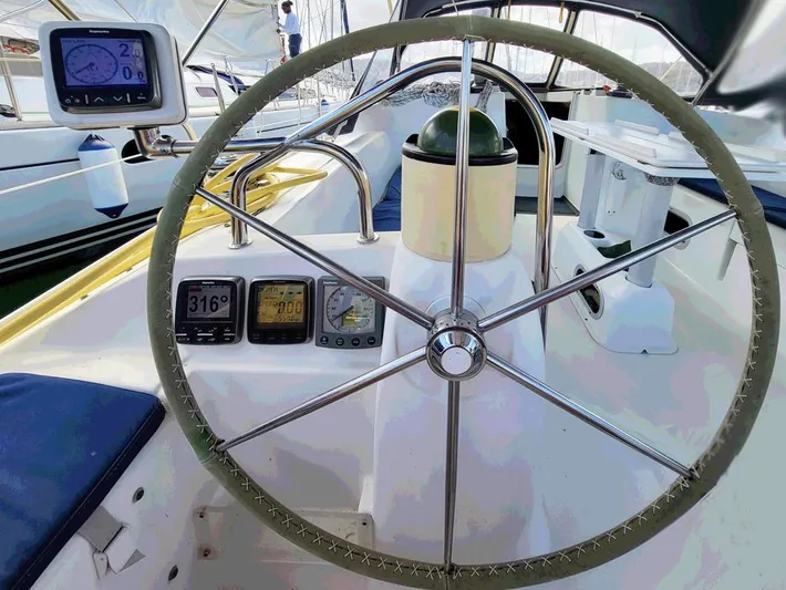  Yacht Photos Pics Steering wheel and instruments on a 2000 Jeanneau Sun Odyssey 40 sailboat.