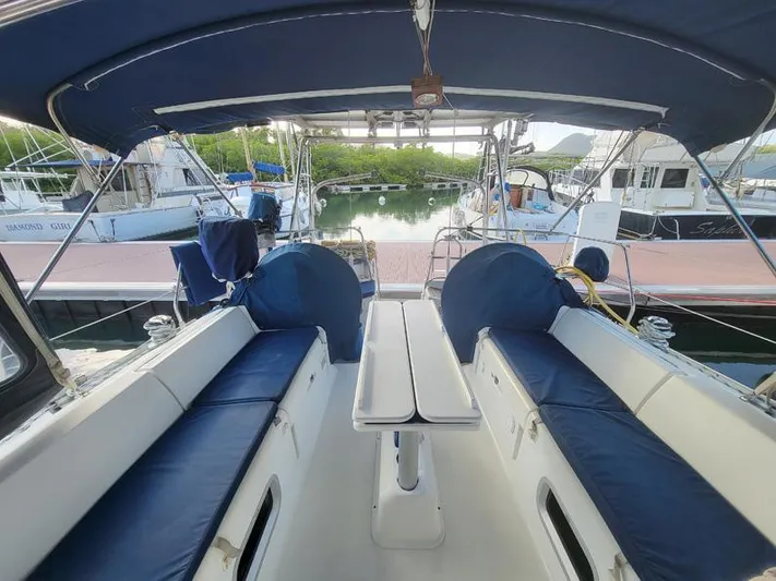  Yacht Photos Pics Jeanneau Sun Odyssey 40 sailboat cockpit with blue cushions, docked at marina, 2000 model.