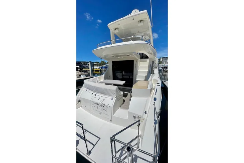 Saline Dion Yacht Photos Pics 2017 Carver C40 yacht docked, featuring spacious deck and elegant design under clear blue sky.