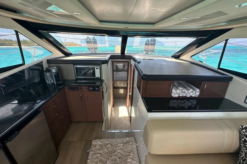 Saline Dion Yacht Photos Pics Luxurious interior of 2017 Carver C40 yacht with modern kitchen and ocean view.