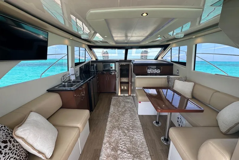 Saline Dion Yacht Photos Pics Luxurious interior of 2017 Carver C40 yacht with elegant seating and ocean view.
