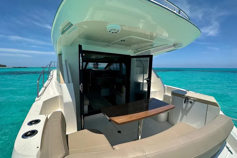 Saline Dion Yacht Photos Pics 2017 Carver C40 yacht with open deck, turquoise sea, and clear sky.