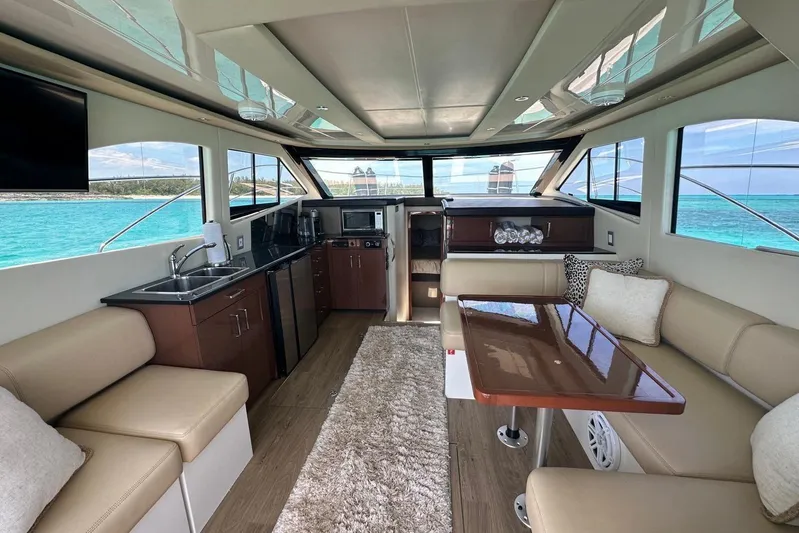 Saline Dion Yacht Photos Pics Luxurious interior of 2017 Carver C40 yacht with modern kitchen and seating area.