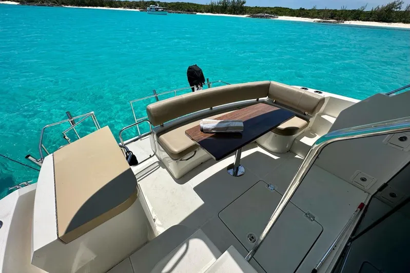 Saline Dion Yacht Photos Pics Luxurious 2017 Carver C40 yacht deck with seating, table, and stunning turquoise water view.