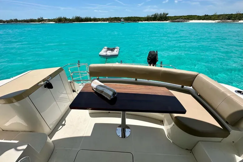 Saline Dion Yacht Photos Pics Luxurious 2017 Carver C40 yacht with elegant seating, table, and stunning turquoise water view.