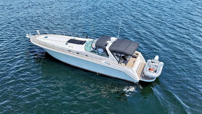 Top Gunns Yacht Photos Pics 1998 Sea Ray 500 Sundancer yacht on open water, aerial view.