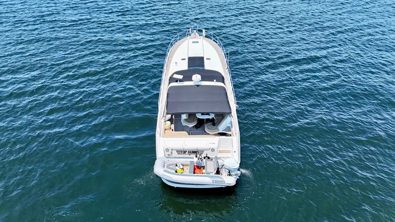 Top Gunns Yacht Photos Pics 1998 Sea Ray 500 Sundancer yacht on open water, aerial view.