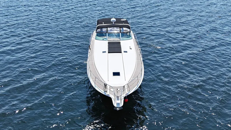 Top Gunns Yacht Photos Pics 1998 Sea Ray 500 Sundancer yacht on open water, aerial view.