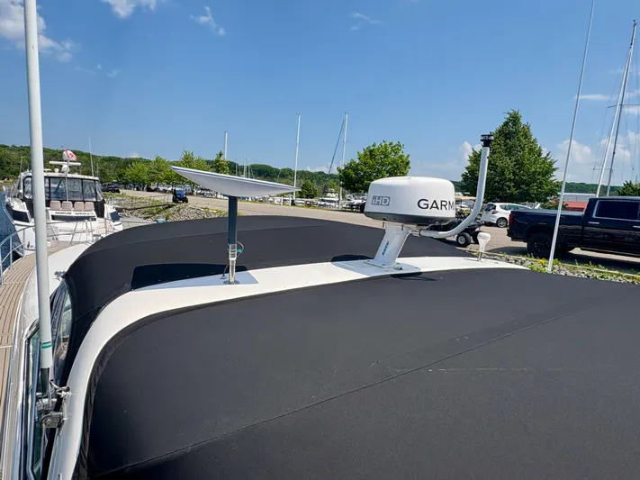 Top Gunns Yacht Photos Pics 1998 Sea Ray 500 Sundancer with Garmin radar and satellite dish on deck, docked at marina.