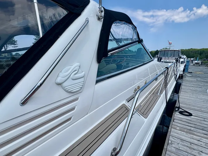 Top Gunns Yacht Photos Pics 1998 Sea Ray 500 Sundancer yacht docked, showcasing sleek design and luxurious features.