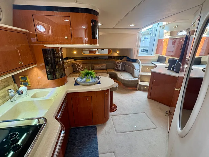 Top Gunns Yacht Photos Pics Luxurious interior of a 1998 Sea Ray 500 Sundancer yacht with elegant wood finishes.