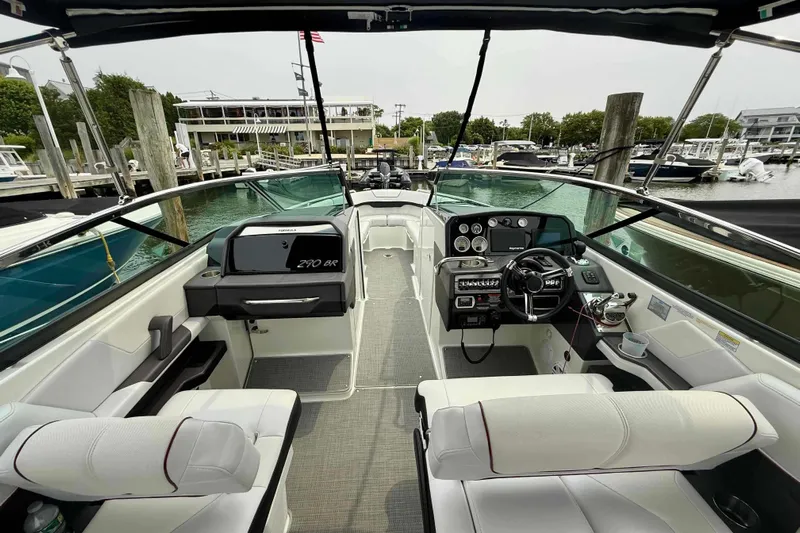  Yacht Photos Pics 2020 Formula 290 Bowrider interior, featuring sleek design and modern controls at a marina.