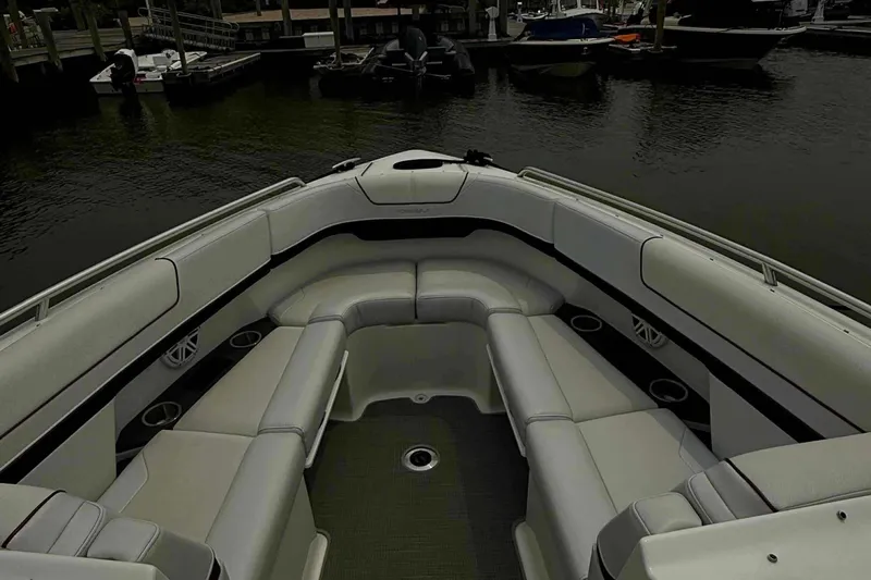  Yacht Photos Pics 2020 Formula 290 Bowrider boat interior with spacious seating at a marina.