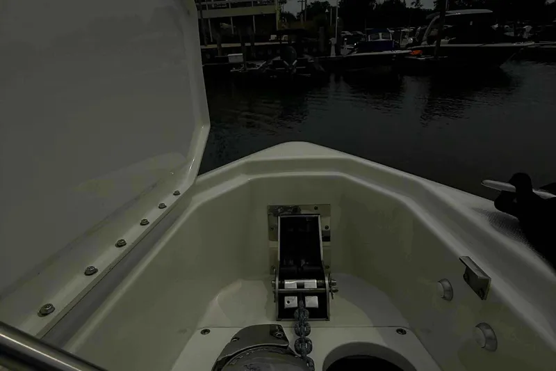  Yacht Photos Pics 2020 Formula 290 Bowrider anchor compartment at marina, showcasing open hatch and chain.