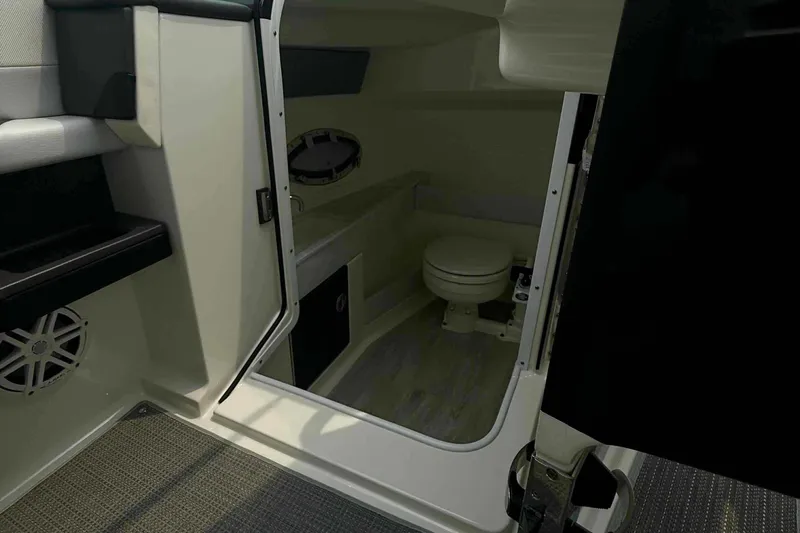  Yacht Photos Pics 2020 Formula 290 Bowrider interior cabin with toilet and modern design.