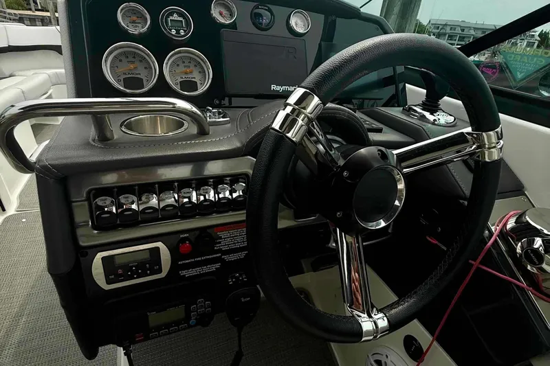  Yacht Photos Pics 2020 Formula 290 Bowrider dashboard with steering wheel and control panel.