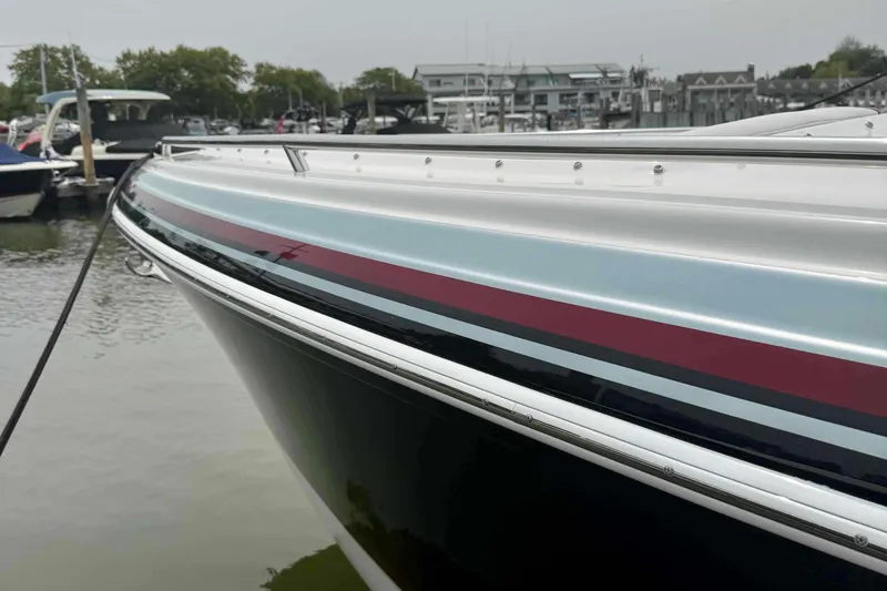  Yacht Photos Pics 2020 Formula 290 Bowrider boat docked at a marina, showcasing sleek design and vibrant colors.
