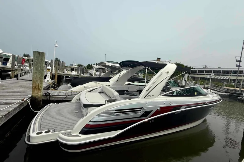  Yacht Photos Pics 2020 Formula 290 Bowrider docked at marina, showcasing sleek design and spacious seating.