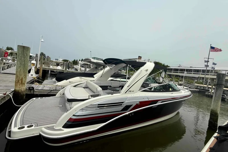  Yacht Photos Pics 2020 Formula 290 Bowrider docked at marina, sleek design, luxury boat.