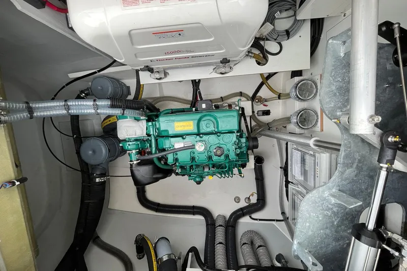  Yacht Photos Pics Engine room of 2023 Fountaine Pajot Tanna 47 catamaran, showcasing mechanical components and wiring.