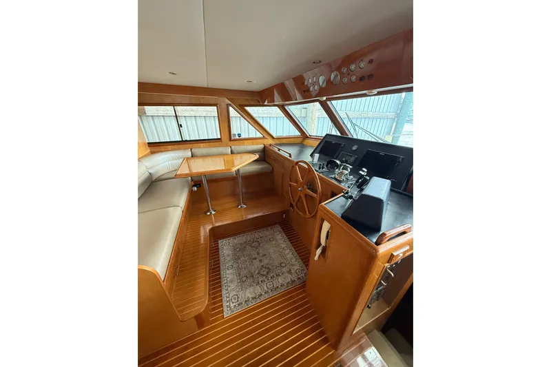 The Dude Yacht Photos Pics Luxurious 1995 Ocean Alexander 486 yacht interior with wood finish and helm station.